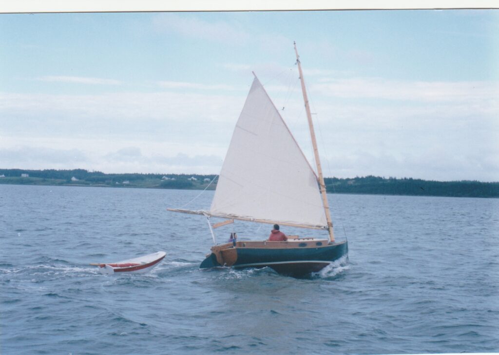 Gaff Catboat double reefed sailing in Lennox Passage, Nova Scotia